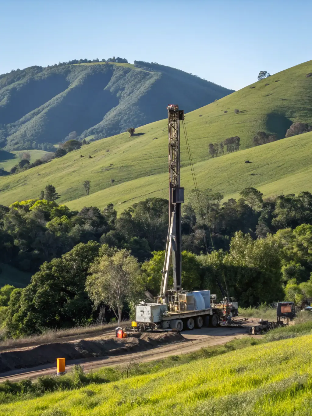 A high-angle photograph of a drilling rig operating in a swampy area of the Niger Delta, showcasing the challenging environment and Foxtrot's operational capabilities.